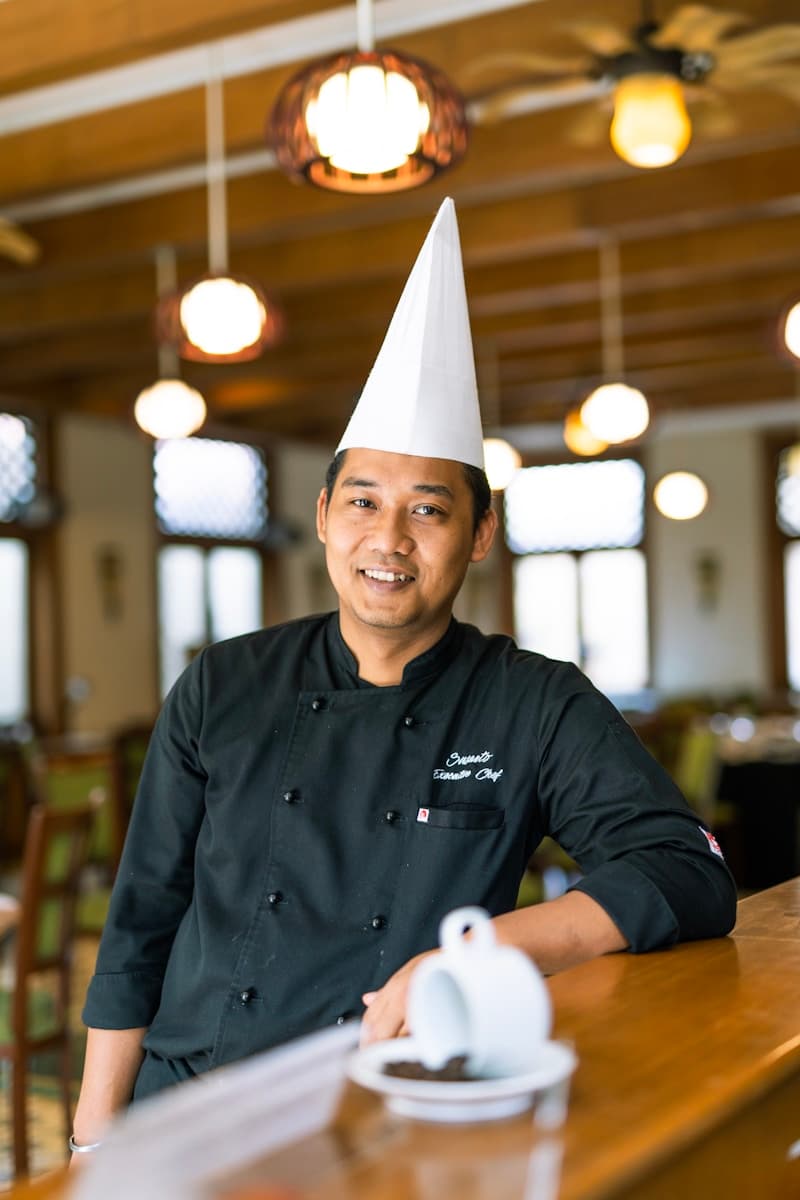 Chef preparing orders on the line in a restaurant kitchen