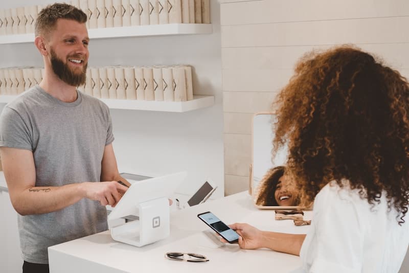 Restaurant cashier taking a payment at the billing counter